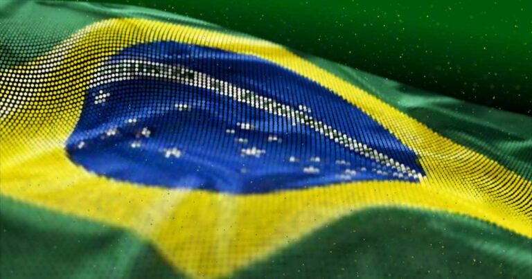 Bandeira do Brasil ondulando com efeito gráfico de pontos sobre a imagem. A composição mantém as cores e elementos tradicionais da bandeira — verde, amarelo, azul e branco — com o círculo azul ao centro contendo a faixa branca com o lema “Ordem e Progresso” e estrelas brancas representando constelações. O efeito de pontos dá um visual digital e moderno à imagem (ABES, IA, era, competitividade)